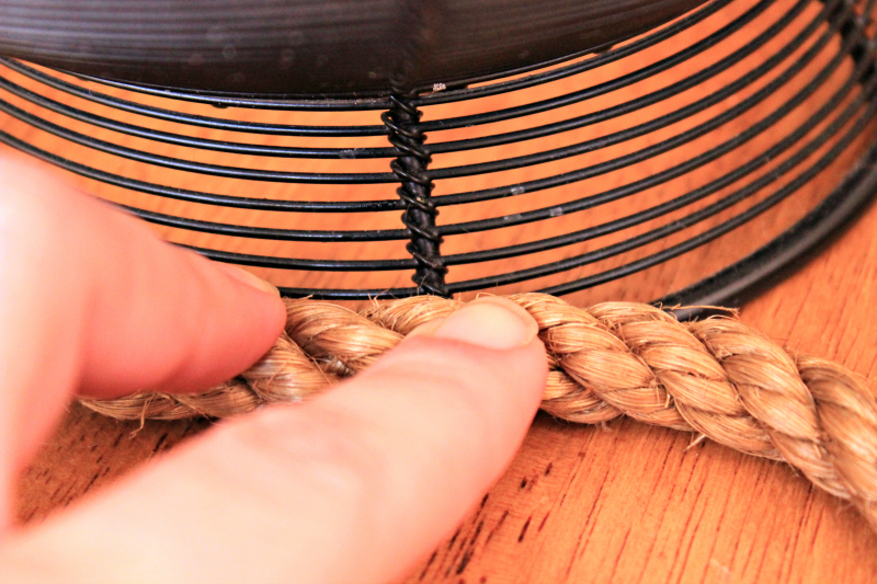 rope-wrapped-wire-gluing-the-rope - C'mon Get Crafty Try an easy update on a frugal find. Wrap a basic wire bowl in rope and add a custom look to your kitchen!
