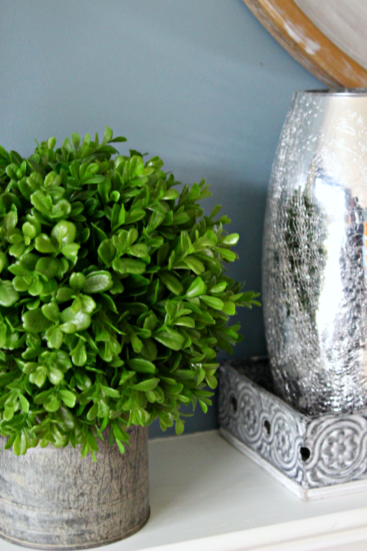 Boxwood planter - C'mon Get Crafty Need some inspiration for mantel decor now that the holidays are over? See how I used boxwood to style a fresh look for my after Christmas mantel.