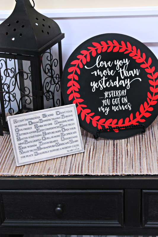 Romance isn't dead, but it doesn't have to be all hearts and flowers either! I made this sassy valentine's day decor because it perfectly summarizes my marriage, ha ha!