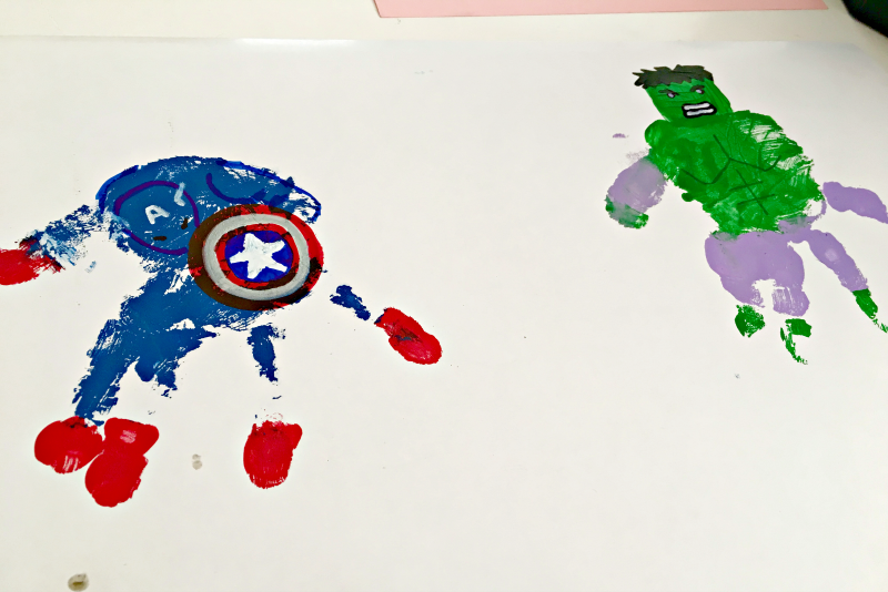 My son loves the Avengers, but I love making art meaningful. So we struck a compromise with this superhero handprint art!