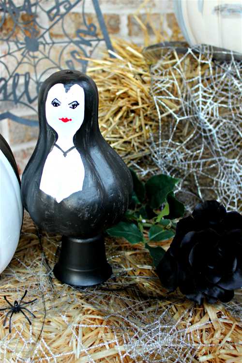 Have you seen the Addams Family - in pumpkin form?? This is a fun and unique front porch display for Halloween!