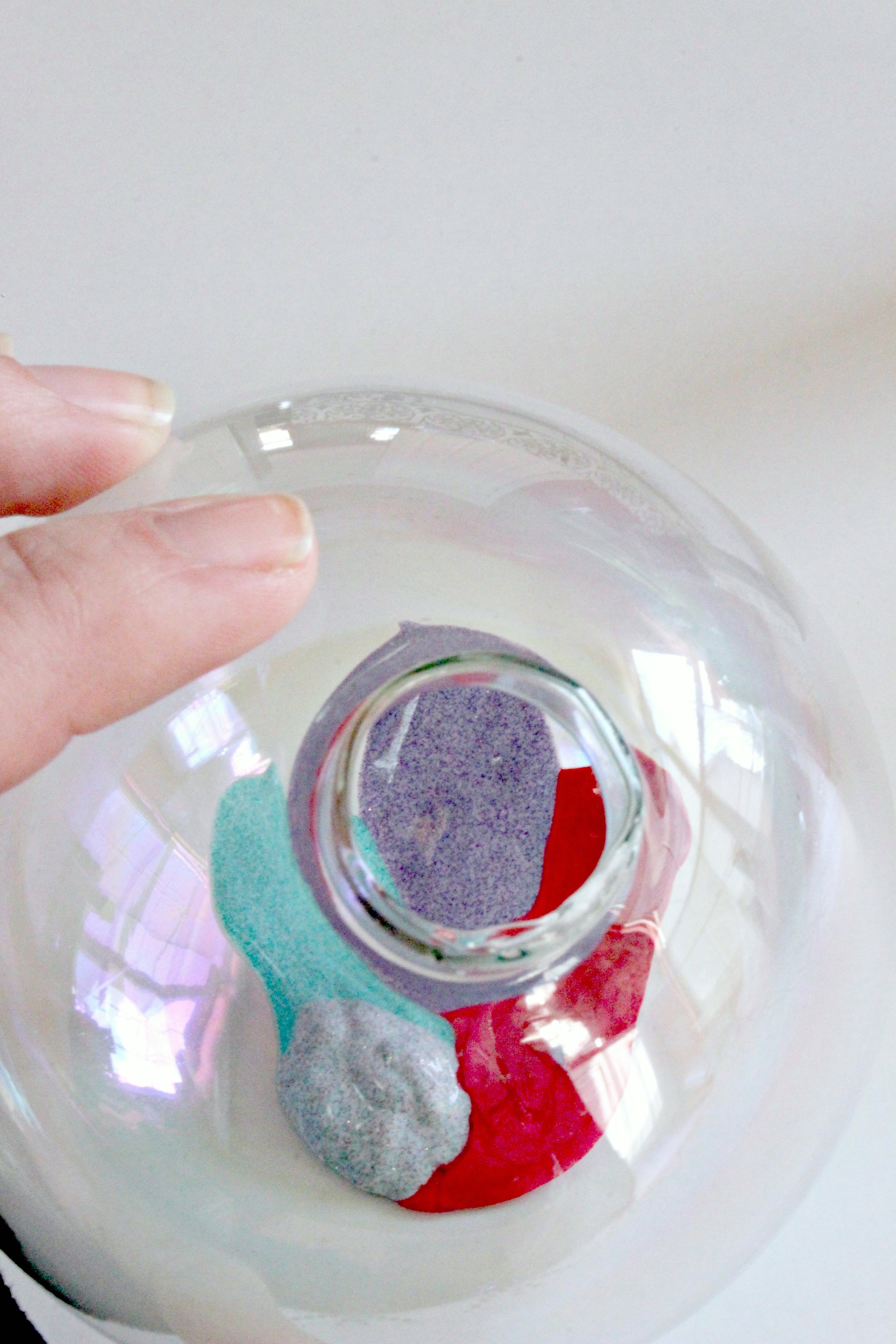 Swirling paint in ornament - C'mon Get Crafty A little glitter and a little creativity creates a fabulous, sparkly unicorn ornament! See how you can make one as well! #christmas #ornamentdiy #unicorndiy