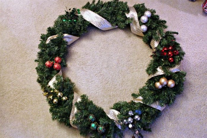Decorating a DIY Christmas wreath-opt - C'mon Get Crafty It isn't terribly hard or expensive to decorate a hand me down Christmas wreath and spruce up your front door!