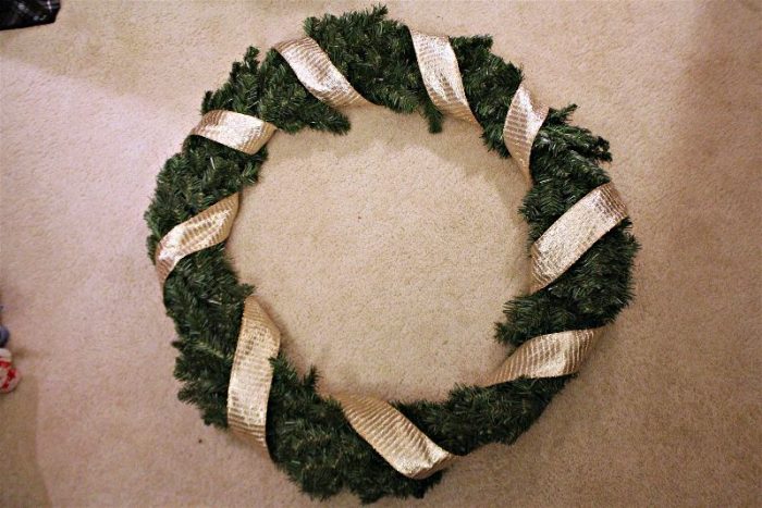 Ribbon wrapped Christmas wreath diy-opt - C'mon Get Crafty It isn't terribly hard or expensive to decorate a hand me down Christmas wreath and spruce up your front door!