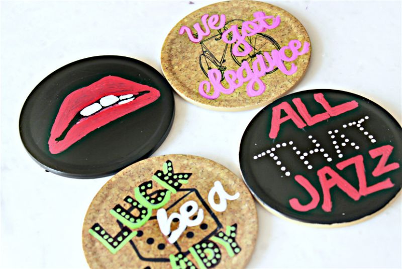 This painted coasters DIY is one of my favorite #MovieMondayChallenge crafts! I was so excited to design some of my favorite show lyrics into art! #paintedcoasters #sharpie #musicals #moviemonday #diy #sharpiecrafts #paintit #paintedcrafts #sharpiepaintpens #rockyhorrorpictureshow #hellodolly #guysanddolls #chicago #allthatjazz #luckbealady #lips #wegotelegance #picmonkey