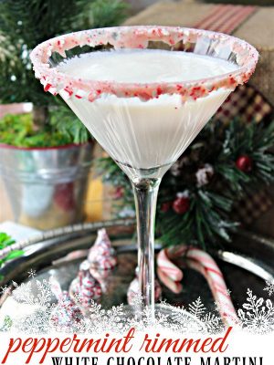 Try this delicious white chocolate martini rimmed in peppermint - the perfect chill this winter! #whitechristmas #christmasmartini #chocolatemartini #peppermintchocolate #25daysofchristmasmovies