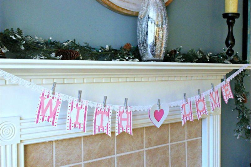 Make an easy and simple Valentine's Day banner to decorate your mantel using craft supplies you probably already own! #CraftroomDestash #valentine #valentinedecor #cricut #cmongetcrafty