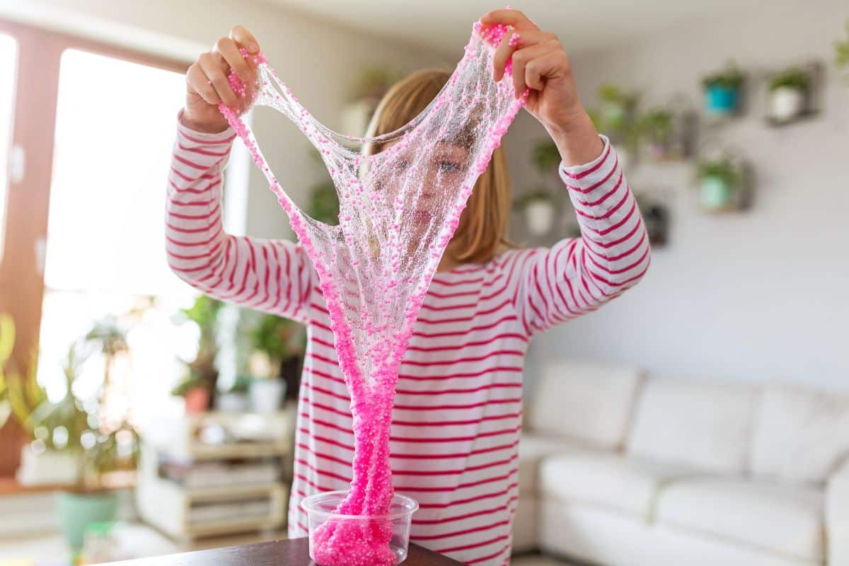 Young child playing with homemade slime