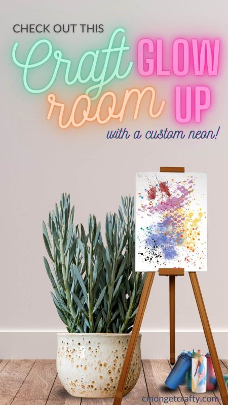 Manhattan Neons Sign Pin Optimized - C'mon Get Crafty Neon text on blank white wall with art easel, spray paint cans, and potted plant