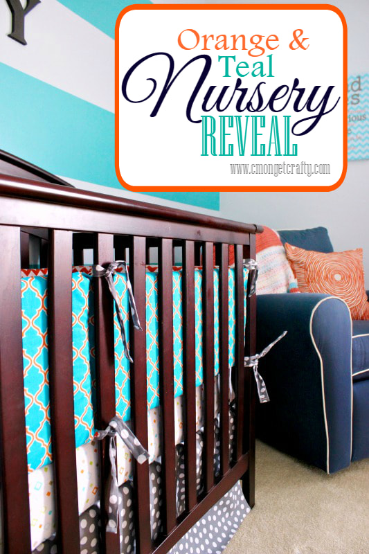 Pinterest image of a brown crib with blue and orange bunting, white crib sheet with orange, green, and blue pattern, and grey polka dot crib skirt next to a navy blue arm chair with orange pillows in front of a teal and grey striped wall with text overlay saying "Orange & Teal Nursery Reveal"