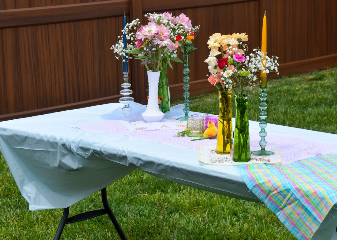 Photo by Miyah Blish - C'mon Get Crafty A table topped with vases filled with flowers