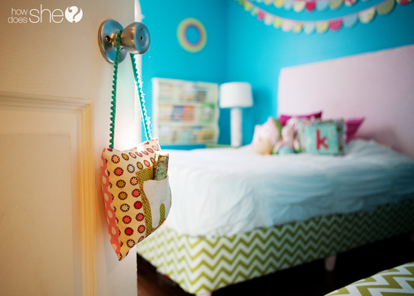 tooth-fairy-pillow-24-copy - C'mon Get Crafty closeup of tooth fairy pillow hanging on doorknob at entrance to child's bright blue bedroom with bed in the background