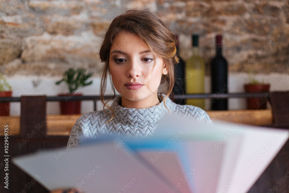 Woman choosing paper for drawing