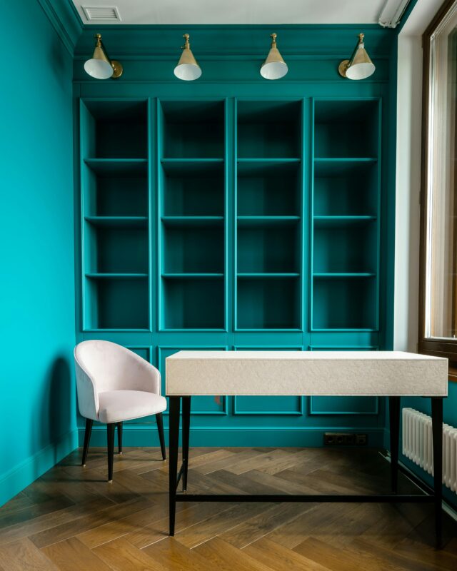 A table and chair near the cabinet